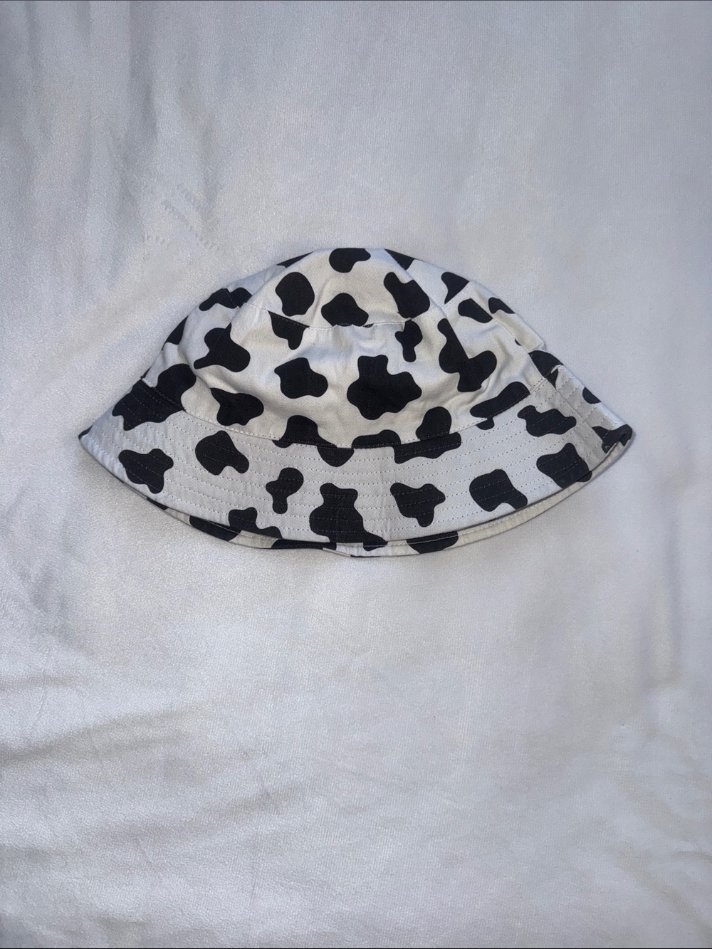 & Other Stories Kids Cow Print Bucket Hat in Black and White